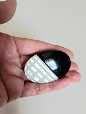 Vintage acrylic plastic and Mother of Pearl two tone black beige oval brooch.